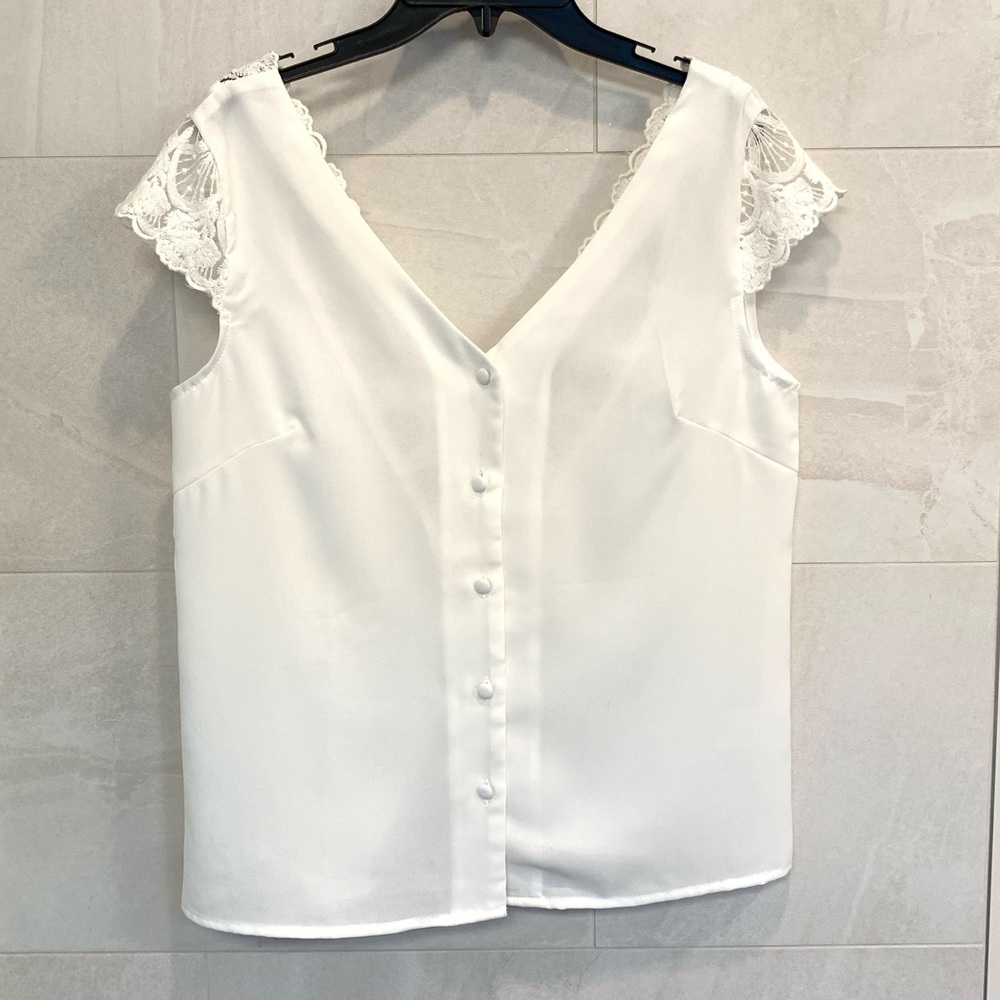 Double v neck line, button up front with lace and fabric button detailing